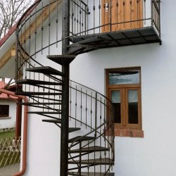 A wrought iron spiral railing - a cottage