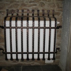 A wrought iron radiator cover