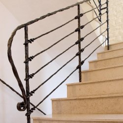 A hand forged stair railing - Knot pattern