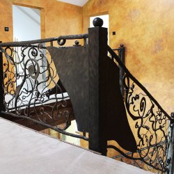 Hand forged interior staircase railing - Roots