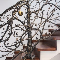 Hand wrought iron interior staircase railing - a tree