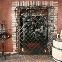 A wrought iron grille in a wine cellar