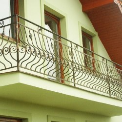 A wrought iron balcony railing