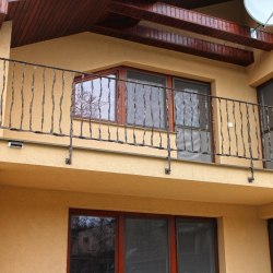A wrought iron balcony railing - crazy
