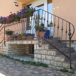 A wrought iron railing - log