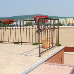 A wrought iron terrace railing