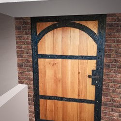 A wrought iron entrance door with wood