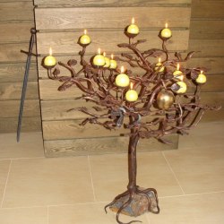 A candleholder - a tree with a snake and apple - Forged candleholders and lamps