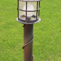A walk down a lit garden - Forged candleholders and lamps