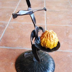 A wrought iron candleholder - The Cross