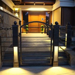 A wrought iron railing with built-in lights