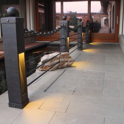 A wrought iron railing with built-in lights