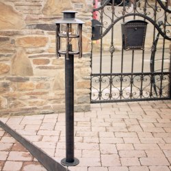 A wrought iron standard lamp Granny - garden lamps