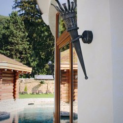 A wrought iron torch in a summer house