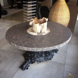 An exclusive wrought iron table of a tree bark design