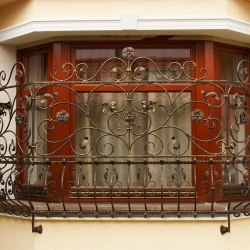 A decorative wrought iron grille