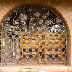 A fixed wrought iron grille