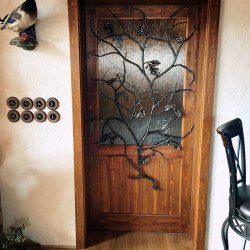 Artistic wrought iron grille in the shape of oak branch