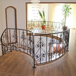 A curved wrought iron railing 