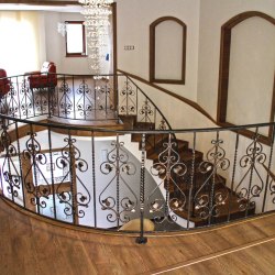 A curved wrought iron railing