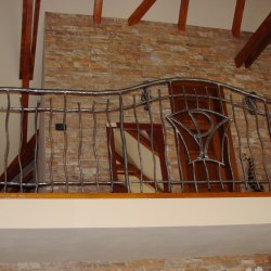 A wrought iron railing - interior - stairs