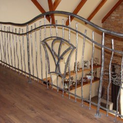 A wrought iron railing - interior - stairs