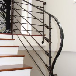 A wrought iron stair railing - Knot pattern